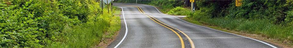 Two lane highway with speed sign