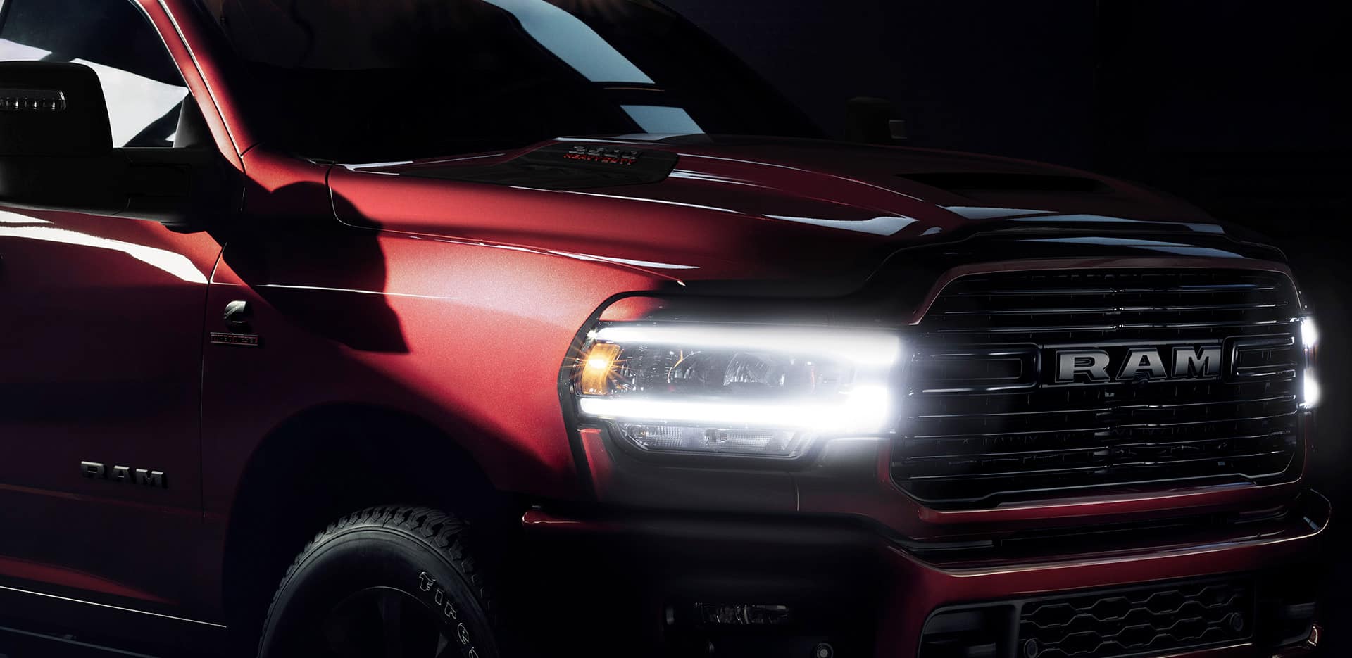 2024 Model Research Close up view of the 2024 RAM 2500 with headlights turned on