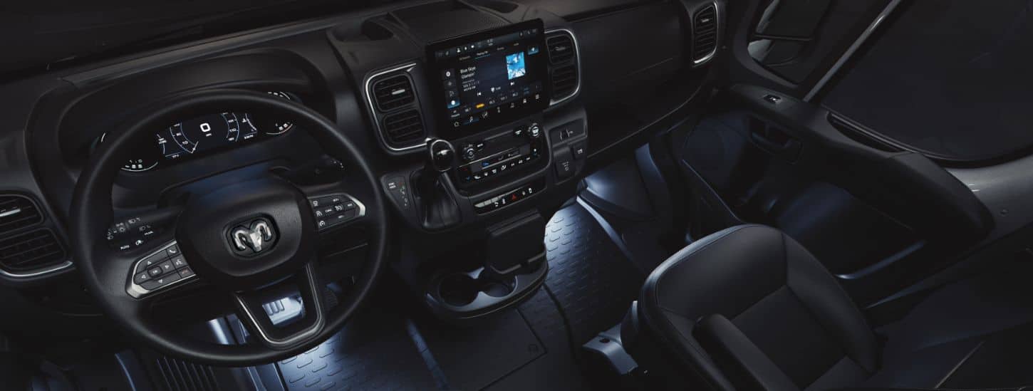 The steering wheel, Driver Information Digital Cluster and the Uconnect touchscreen in the 2024 Ram ProMaster Cargo Van.