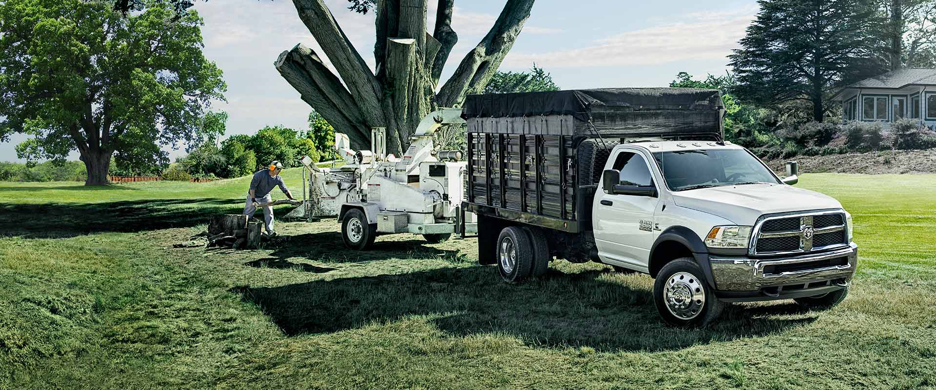 2018 Ram Chassis Cab towing a large tree stump