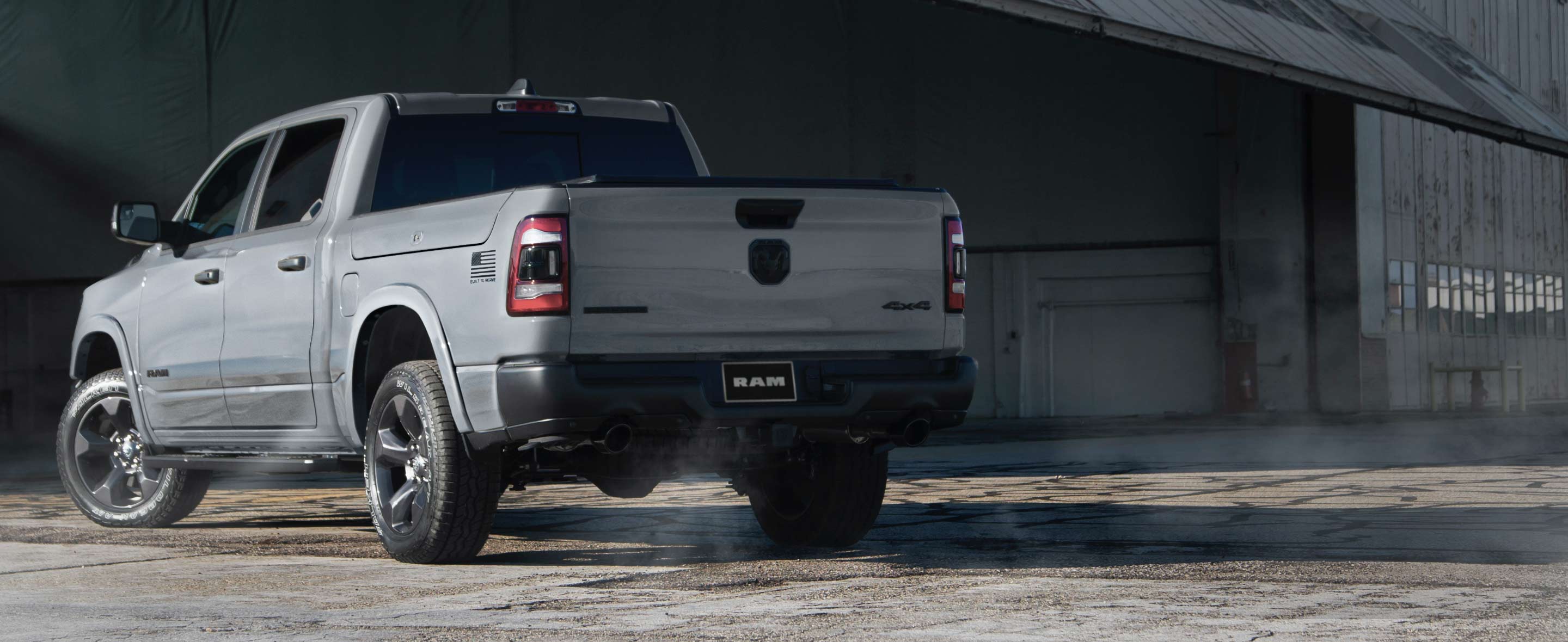 A three-quarter rear view of the 2021 Ram 1500 Built to Serve Edition inspired by air combat, in Billet Silver.