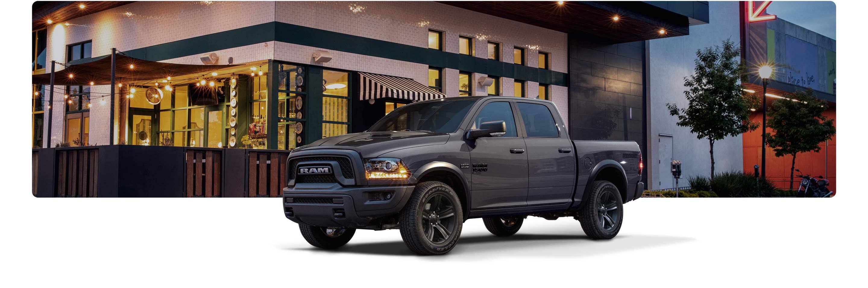 The 2021 Ram 1500 Classic parked outside a brightly lit restaurant patio.