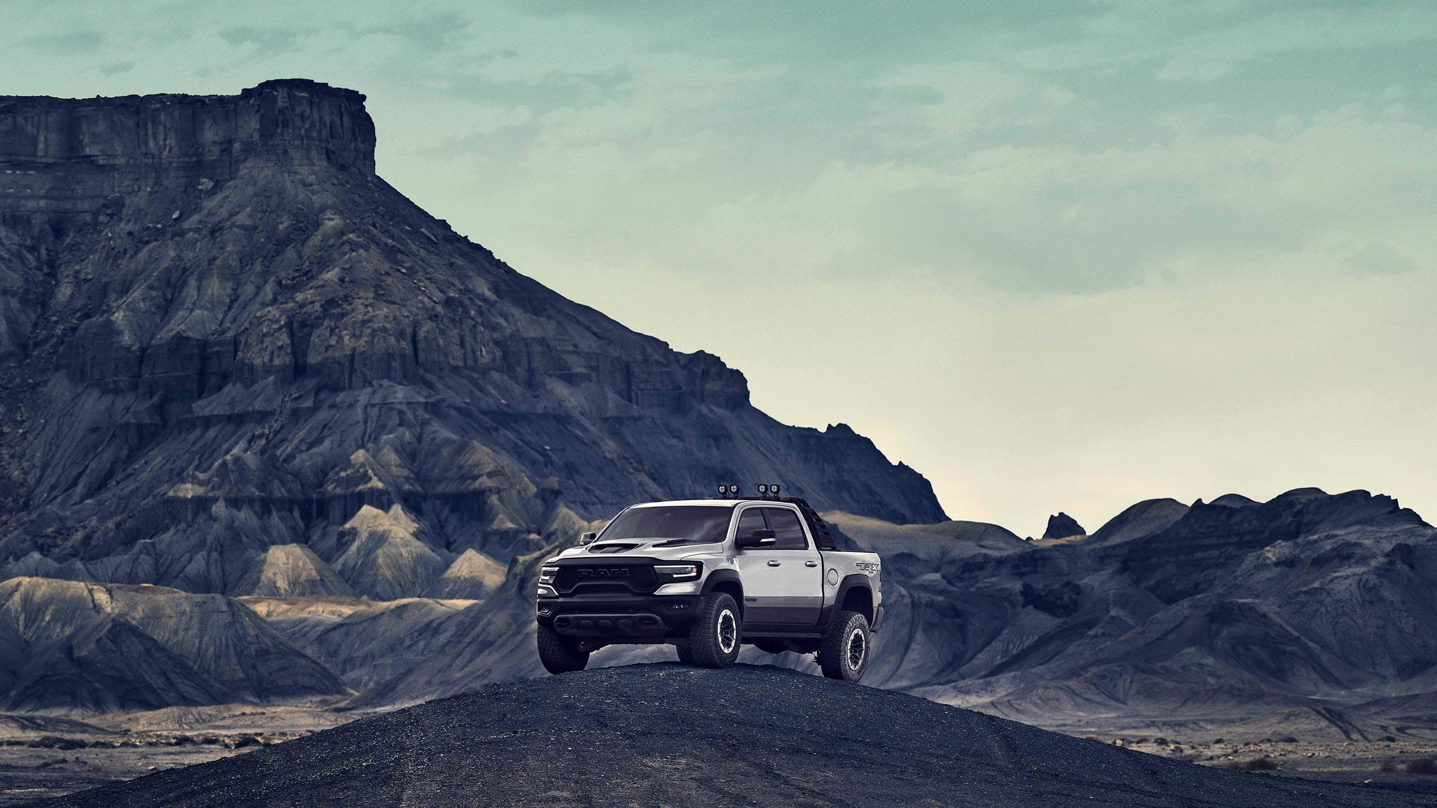 The 2021 Ram 1500 TRX parked against a mountain backdrop.