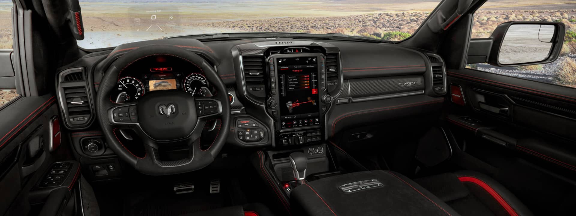 Interior shot from the perspective of the driver seat in the 2021 Ram 1500 TRX showcasing premium interior materials and technology.