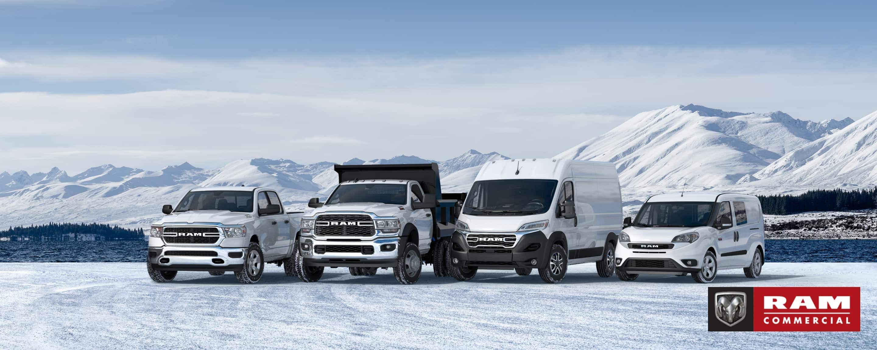  A winter scene consisting of a lineup in white of Ram Trucks and Vans parked on a snow-covered clearing with mountains in the background. From left to right: a 2022 Ram 1500 Tradesman 4x4 Crew Cab, a 2022 Ram 5500 Tradesman 4x4 Regular Cab, a 2023 Ram ProMaster High Roof Cargo Van and a 2022 Ram ProMaster City Wagon. Ram Commercial.