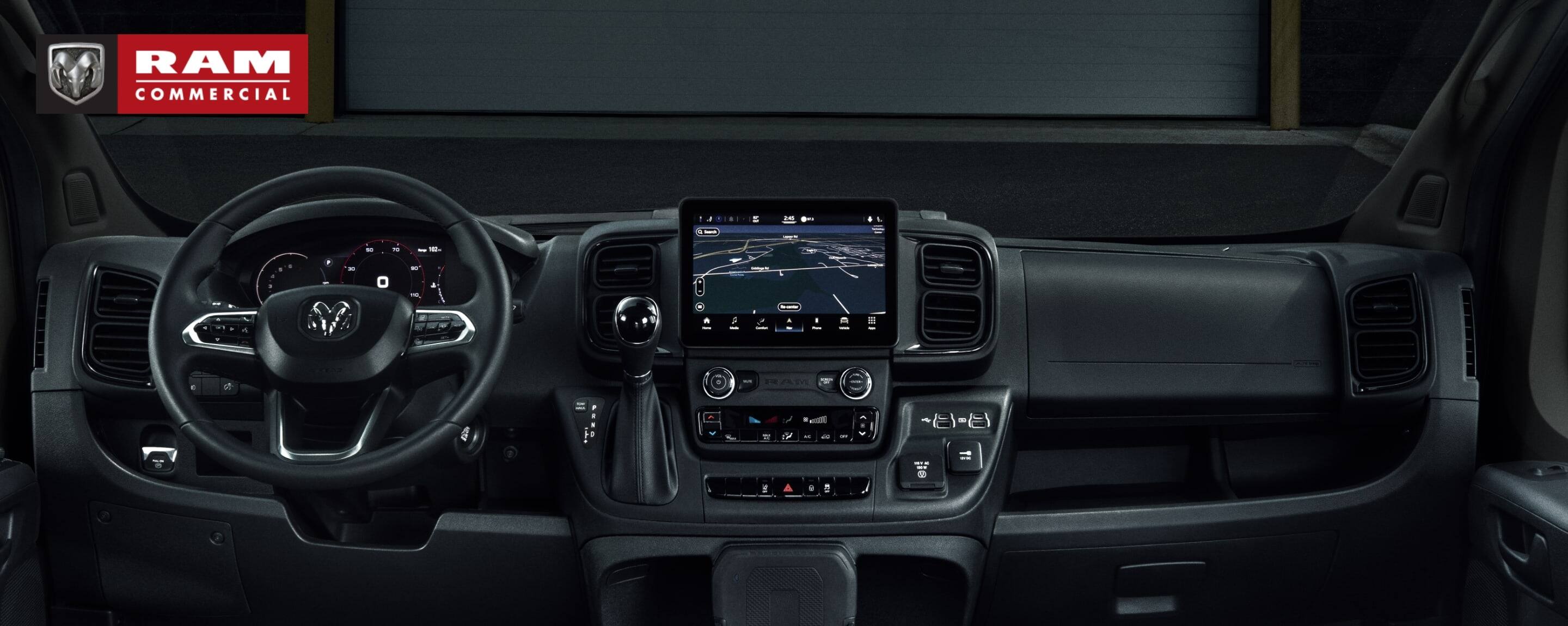 The steering wheel, Uconnect touchscreen, center stack controls and dash in the 2022 Ram ProMaster. Ram Commercial.