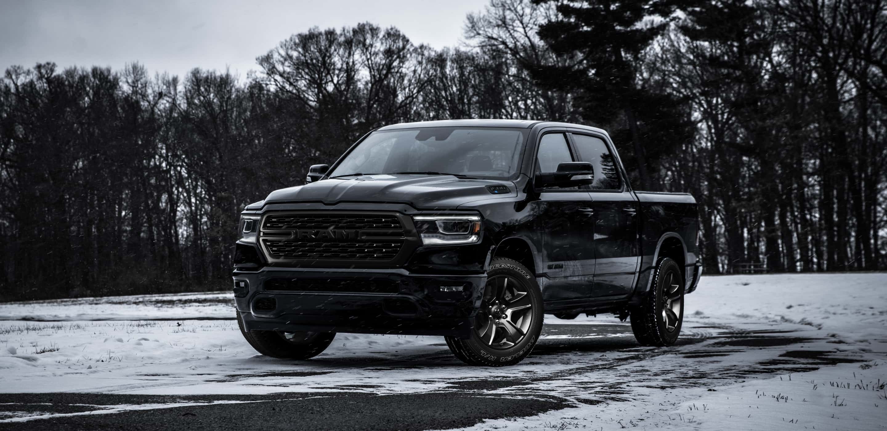 Display The 2022 Ram 1500 parked on a snowy road.
