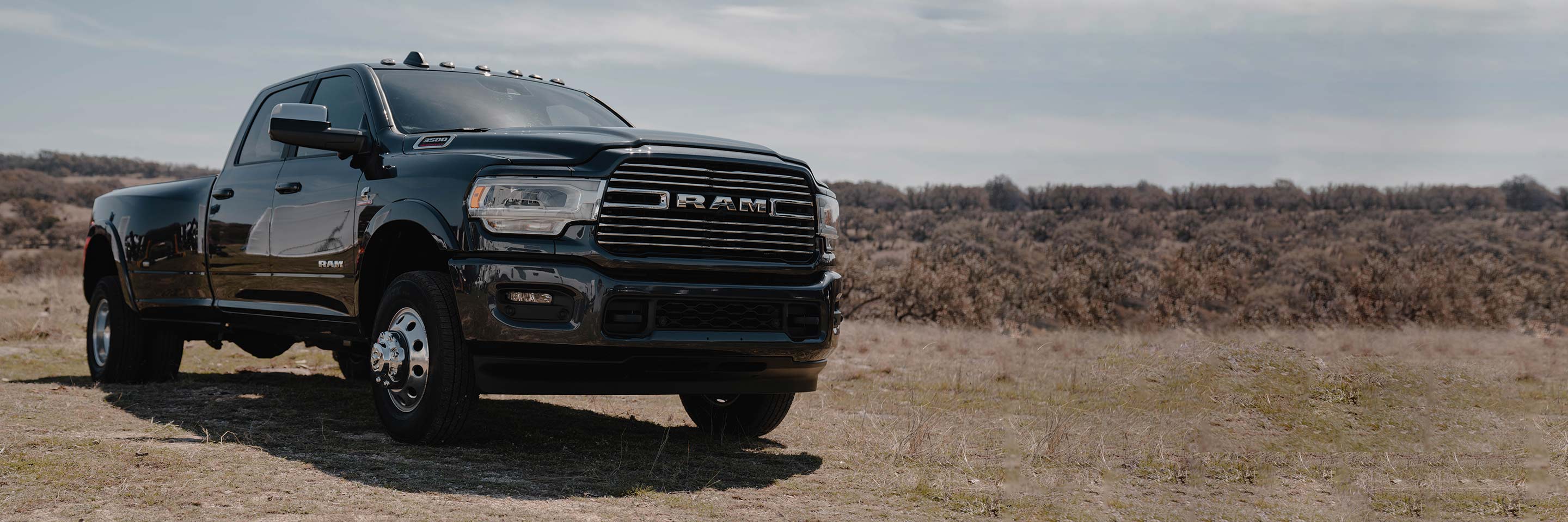 A three-quarter profile of the 2022 Ram 3500 parked off-road.