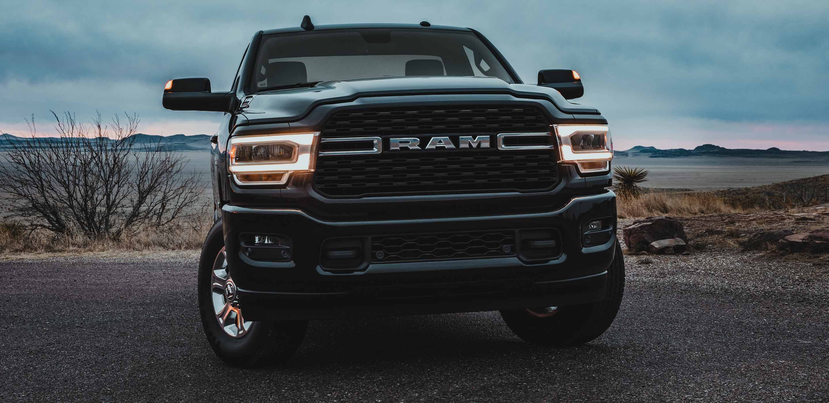 Display A head-on view of the 2022 Ram 3500 with its headlamps lit.
