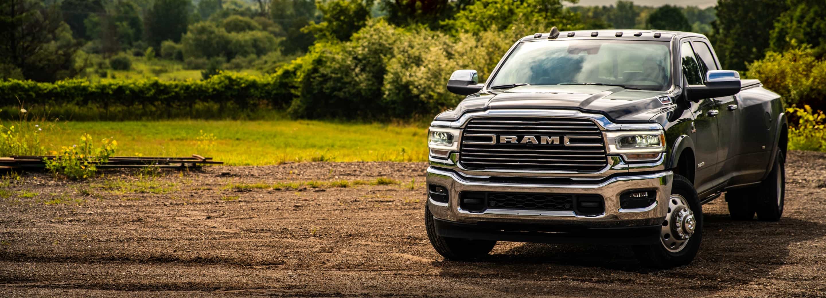 A head-on view of the 2022 Ram 3500 parked on gravel.