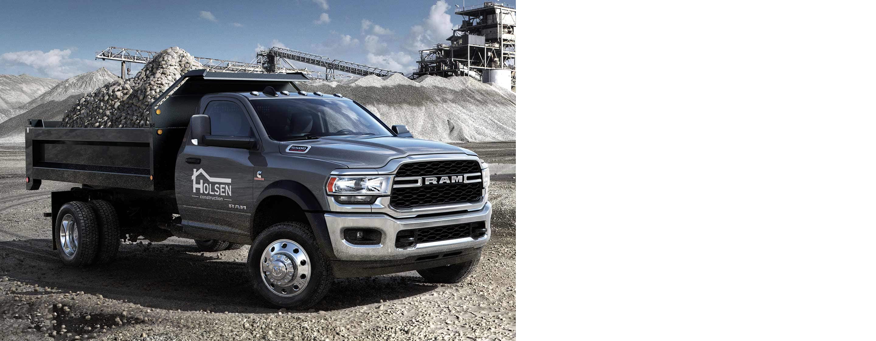 The 2022 Ram Chassis Cab with a dump truck upfit loaded with gravel.