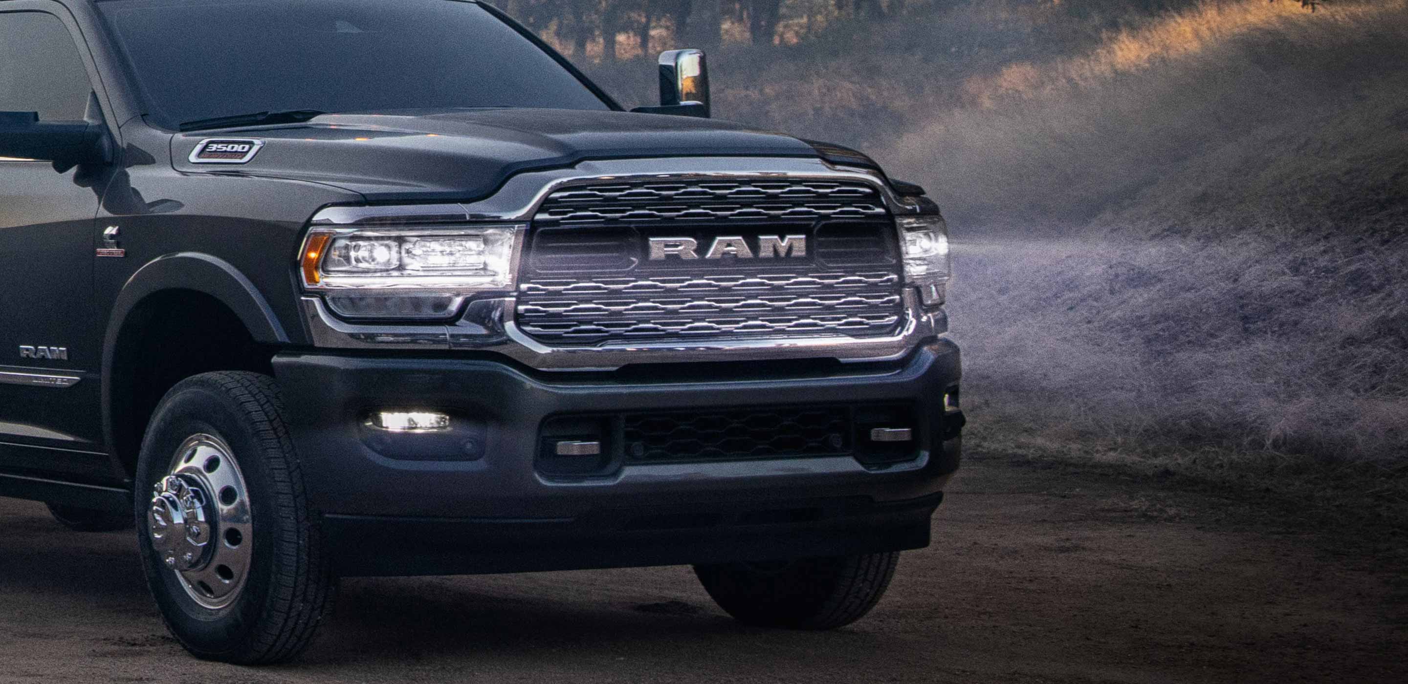 Display The 2022 Ram Chassis Cab with its LED headlamps on, illuminating the road ahead.