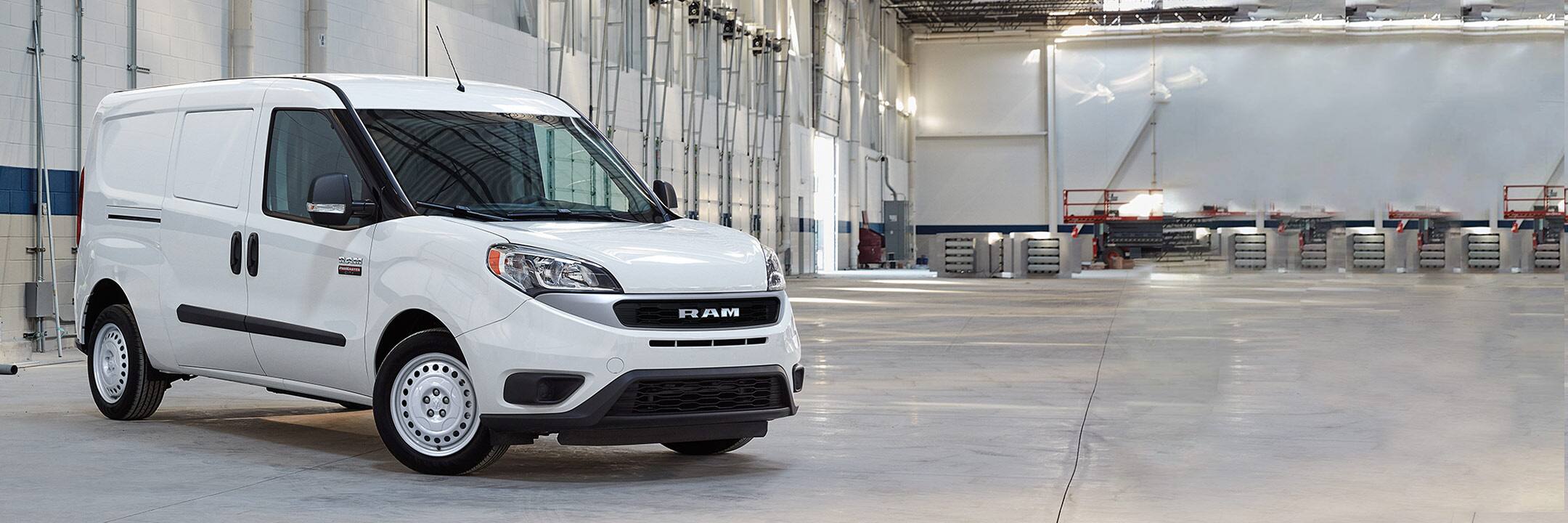 A three-quarter front profile of the 2022 Ram ProMaster City parked in a brightly lit warehouse.