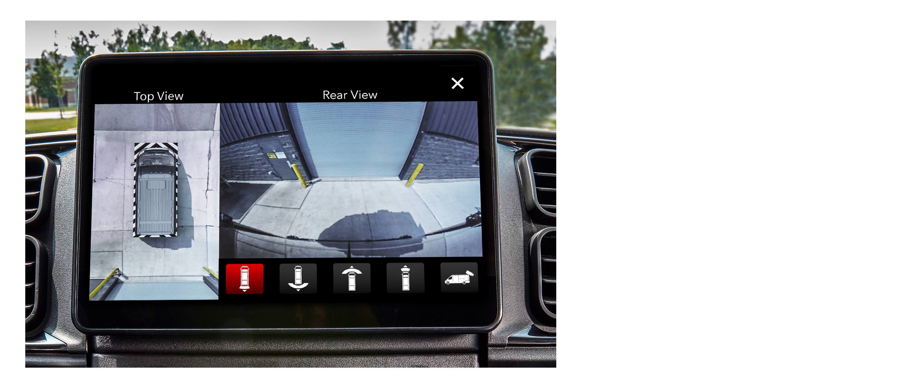 The Uconnect touchscreen in the 2022 Ram ProMaster showing a split screen with the top view and rear view of the van.
