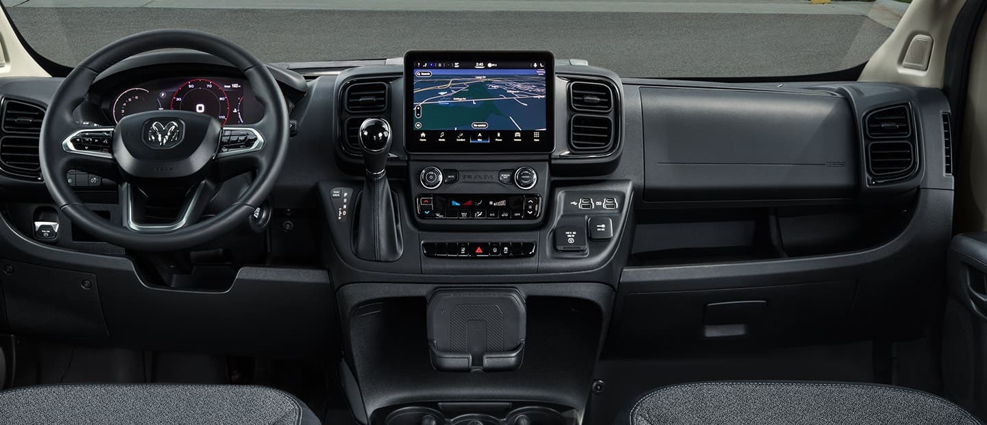 The steering wheel and Uconnect touchscreen in the 2022 Ram ProMaster with a route map on screen.