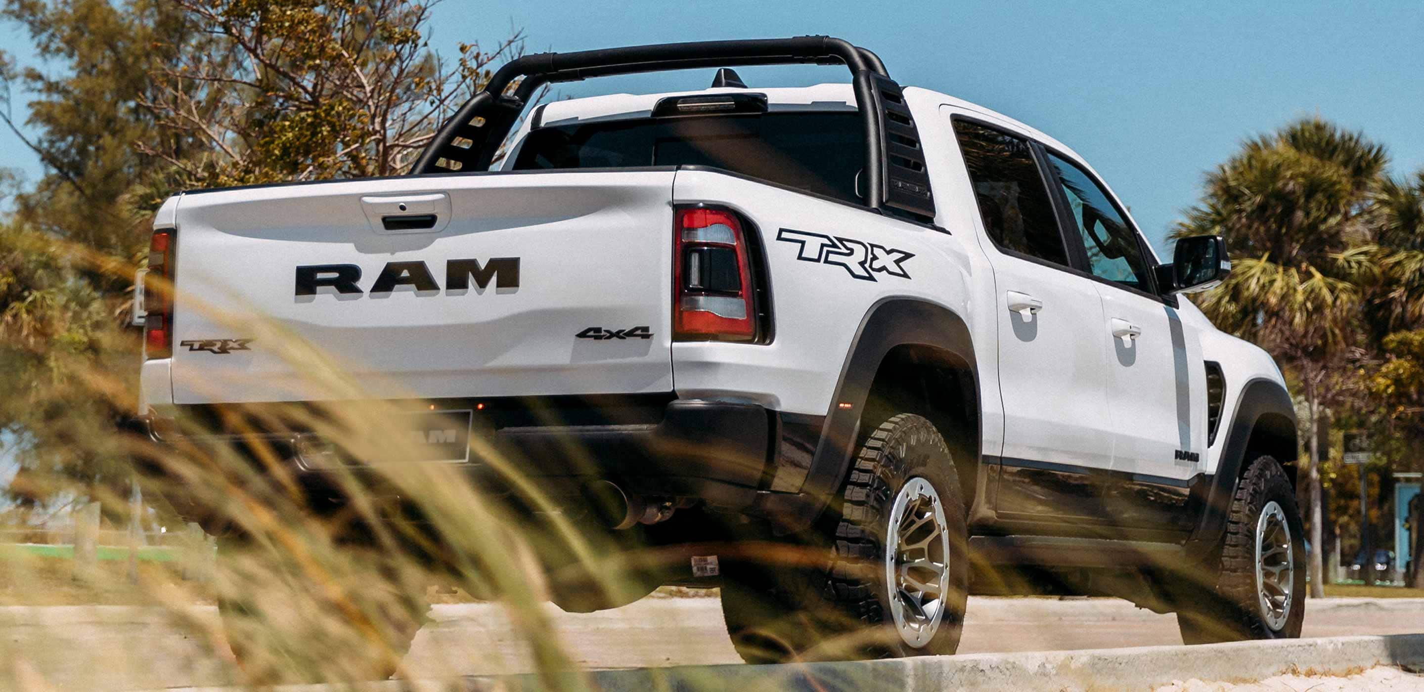Display The 2022 Ram TRX with available Ram Bar parked on the street.