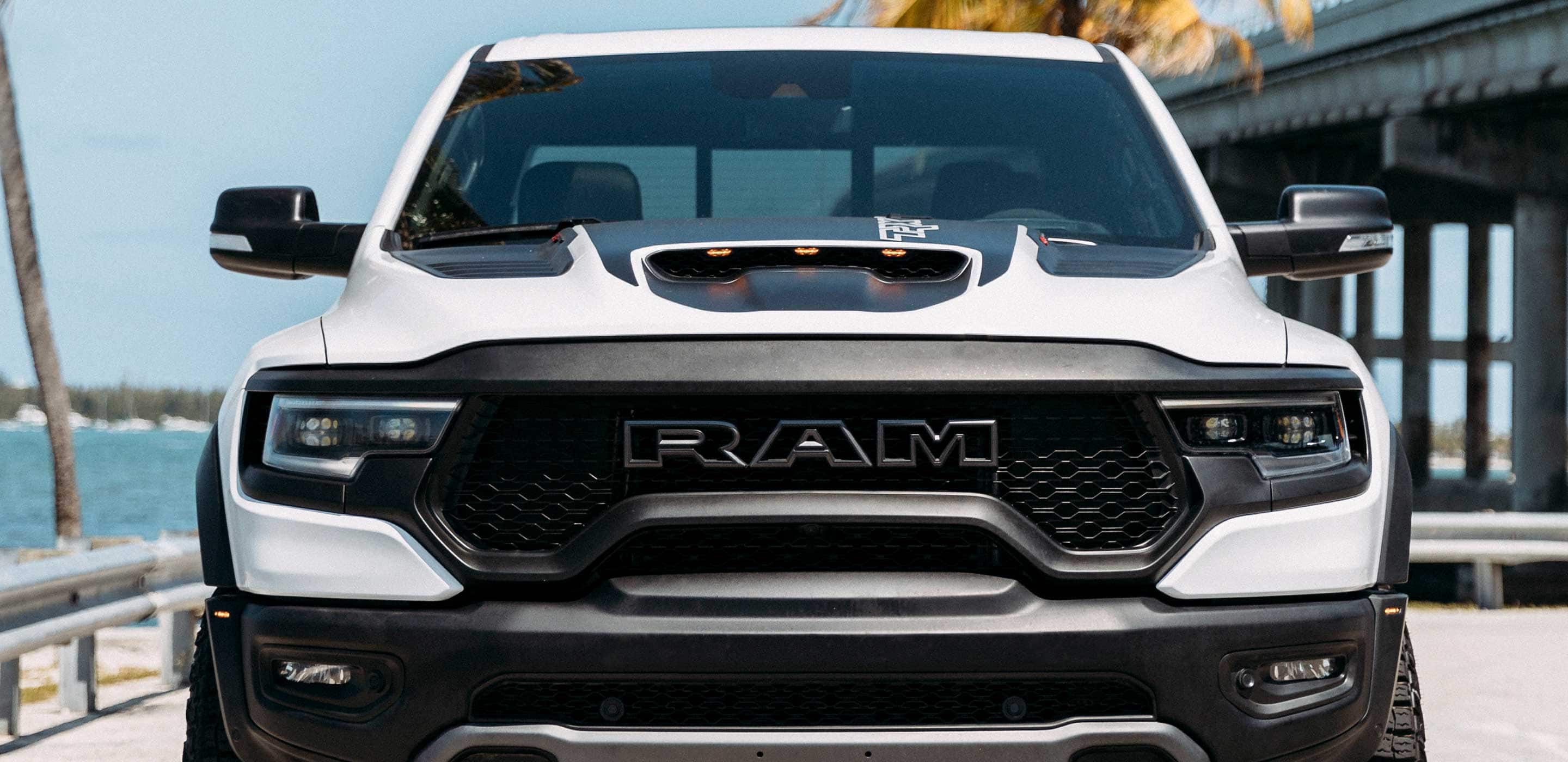 Display A head-on view of the 2022 Ram TRX showing the hood scoop and built-in LEDs.