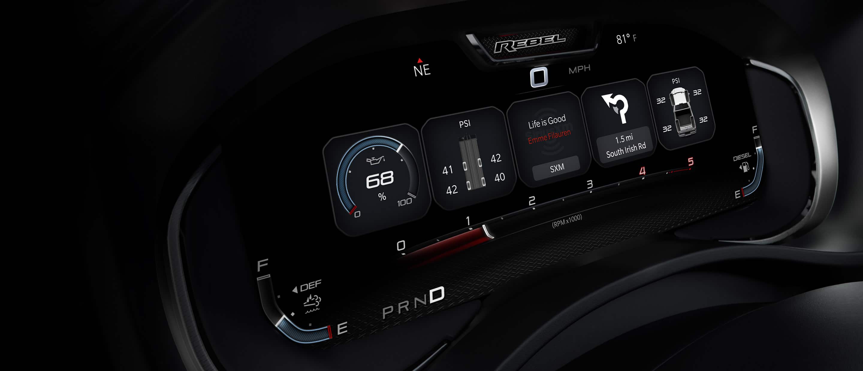 The Driver Information Digital Cluster in the 2023 Ram 2500 Rebel, displaying the fuel level, truck and trailer tire pressure, music selections and navigation directions.