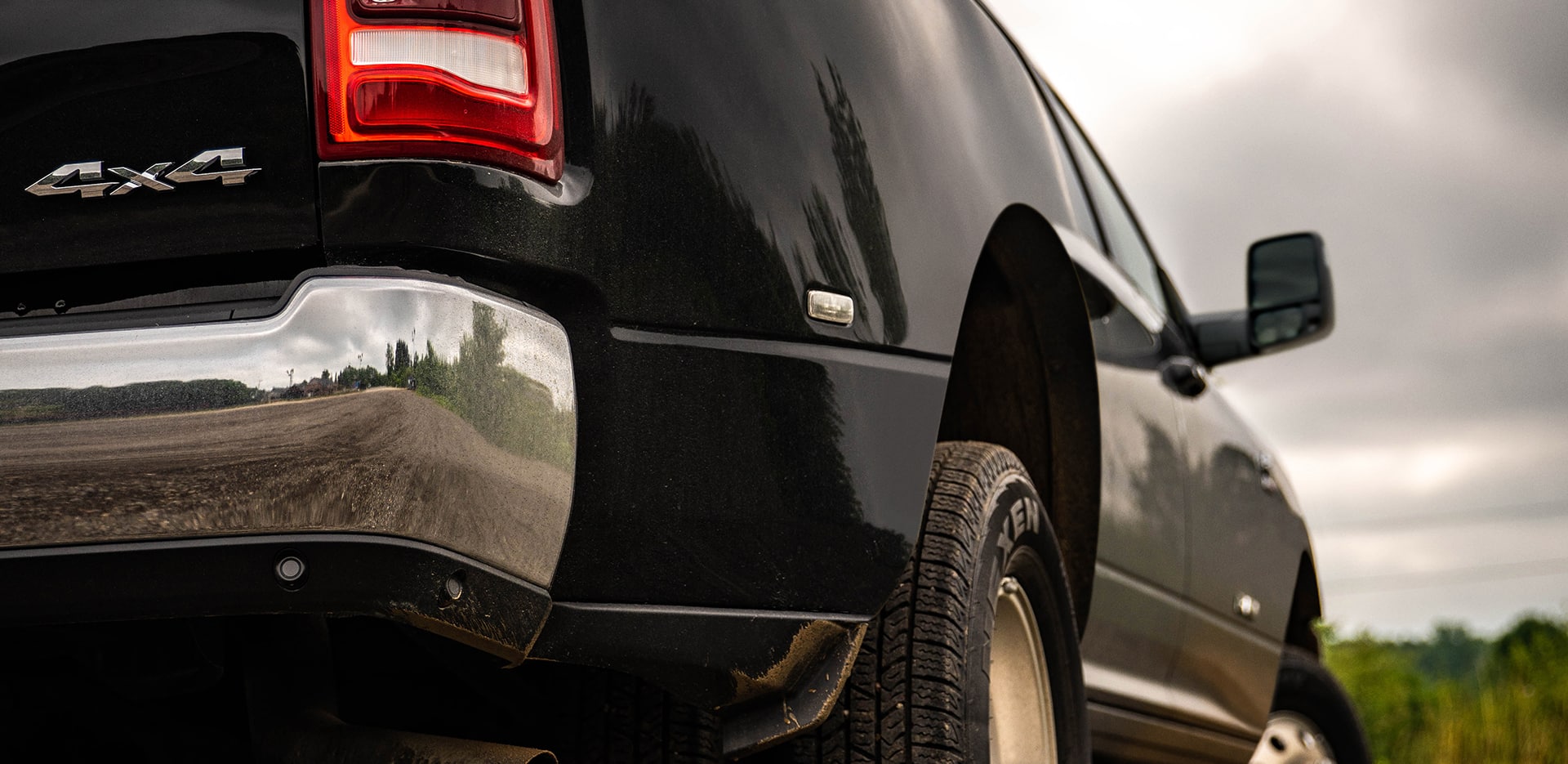 Display A close-up of the 4x4 badge on the rear bumper of the 2023 Ram 3500 Laramie.