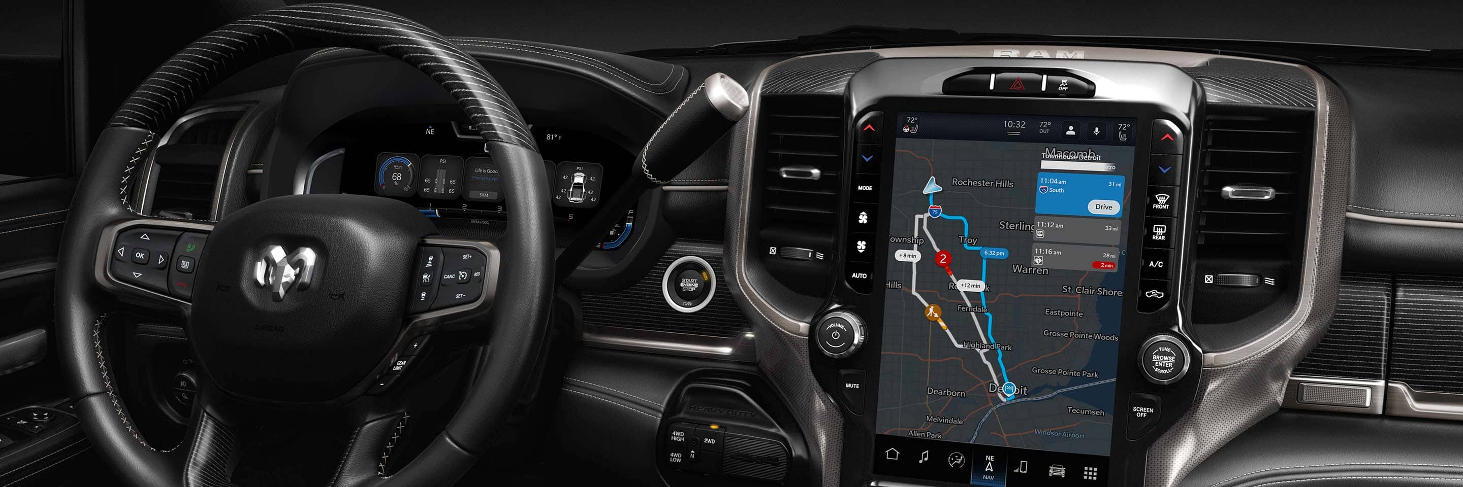 The steering wheel and Uconnect touchscreen in the 2023 Ram 3500 Limited, with the screen displaying a navigation map.