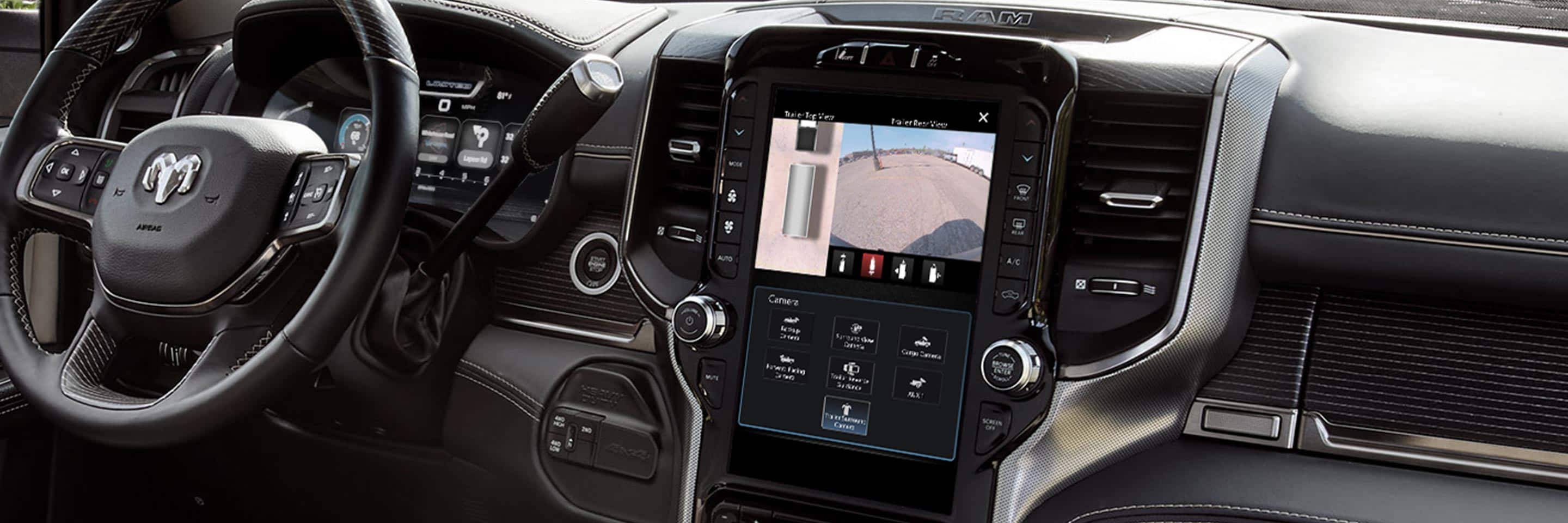 The interior of the 2023 Ram Chassis Cab focusing on the Uconnect touchscreen displaying the output of the surround view camera.