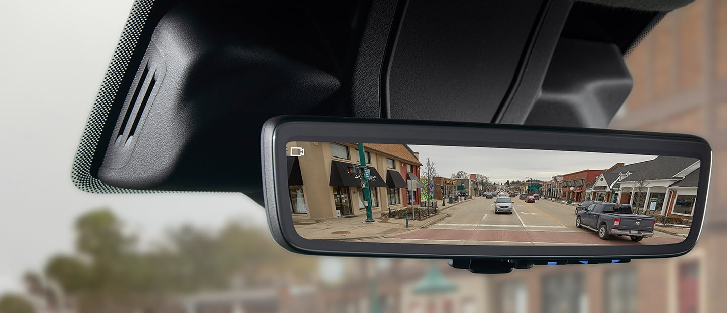 The Digital Rearview Mirror in the 2023 Ram ProMaster, showing the area behind the van with a video camera icon in the corner of the mirror to indicate the camera is on.