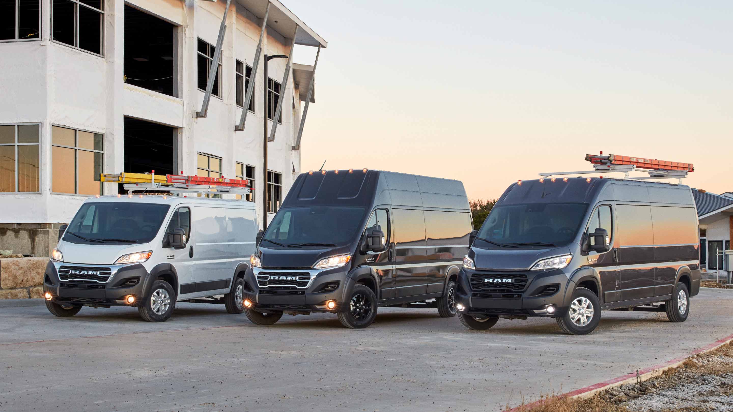 Display A lineup of three 2023 Ram ProMaster Vans: a 1500 Cargo Van, a 3500 Cargo Van Super High Roof and a 2500/3500 Cargo Van High Roof.