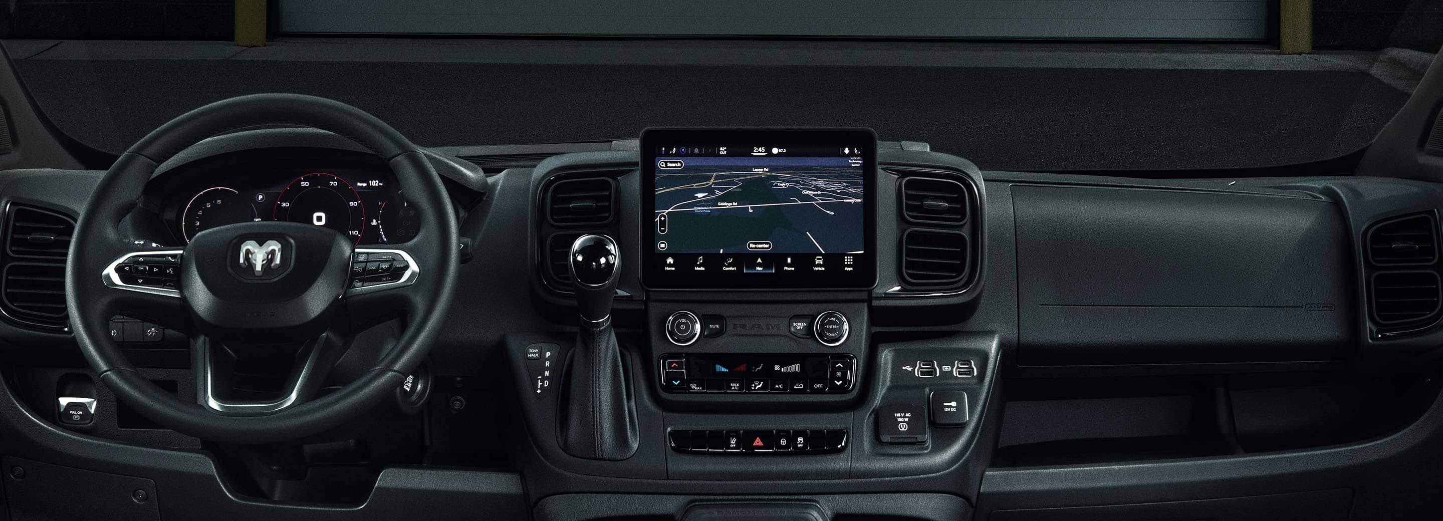The interior of the 2023 Ram ProMaster, focusing on the steering wheel, touchscreen and climate controls.