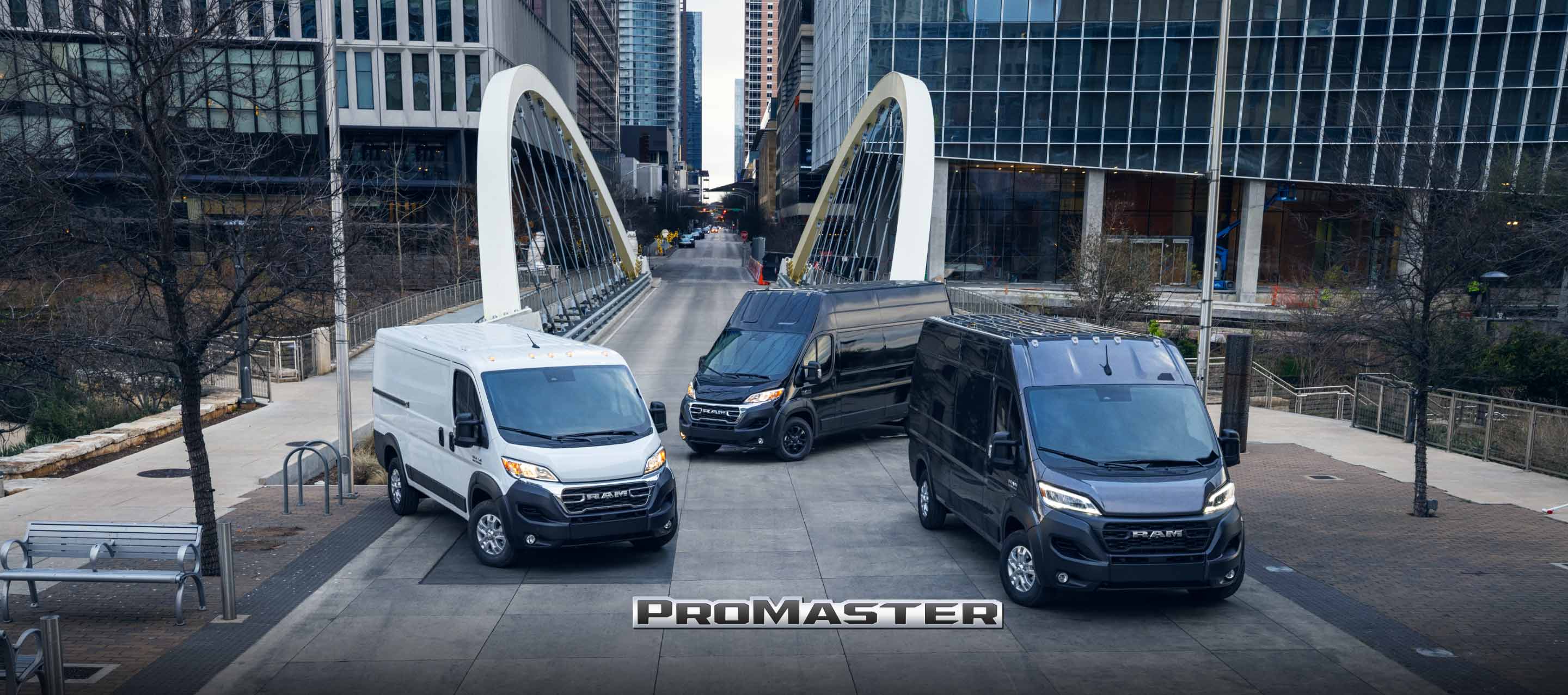 A lineup of 2023 Ram ProMaster models, from left to right: the Ram ProMaster 1500 Cargo Van, the Ram ProMaster 3500 High Roof Cargo Van and the Ram ProMaster 2500 Cargo Van Super High Roof.