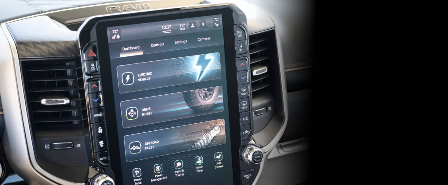 The Uconnect touchscreen in a 2027 Ram 1500 Rev Crew Cab displaying the system dashboard including selections for Electric Vehicle, Drive Modes and Off-Road Pages.