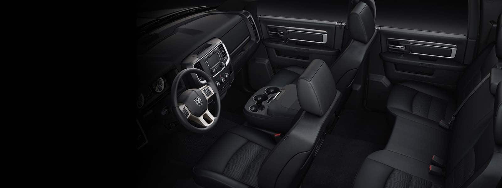 A raised angle of the cabin in the 2024 Ram 1500 Classic, focusing on the front and rear seats.