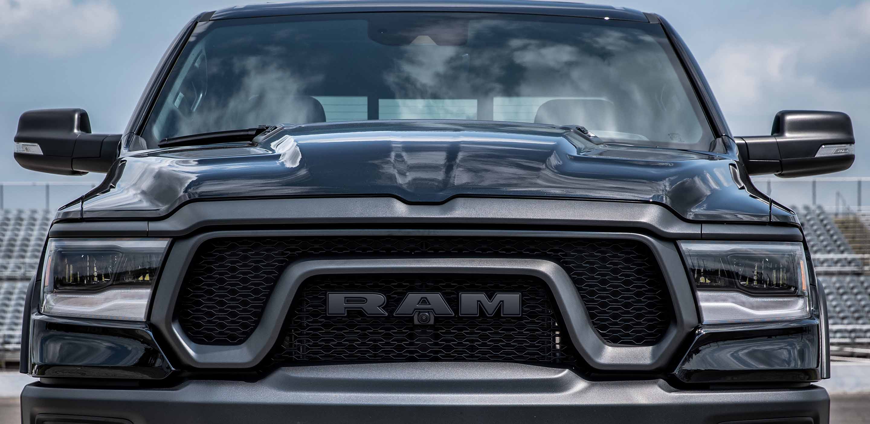 Display A head-on angle of the 2024 Ram 1500 Rebel, focusing on the grille and headlamps.