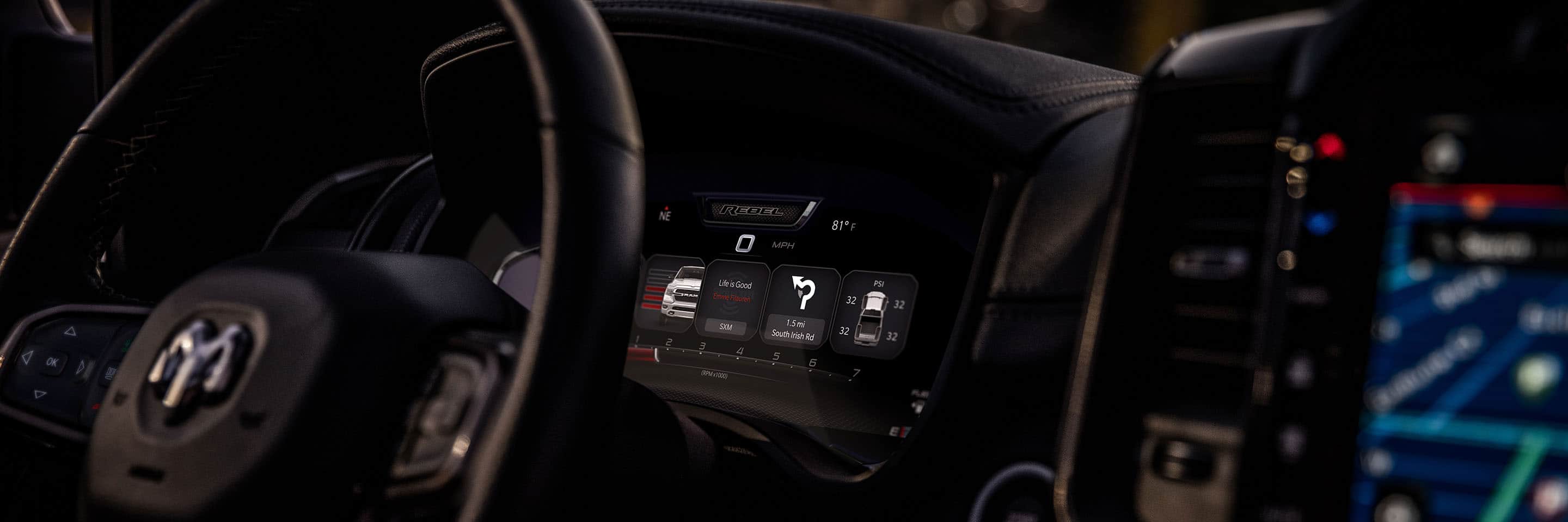 A close-up of the Driver Information Digital Cluster in the 2024 Ram 1500 Rebel, displaying a variety of vehicle, entertainment and navigation information.