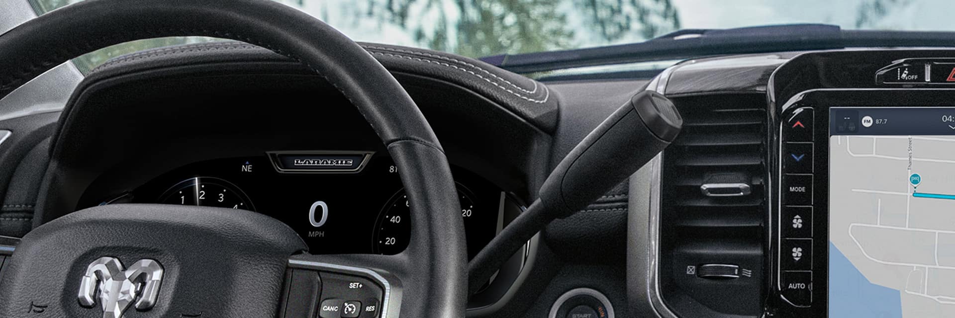 The steering wheel and Driver Information Digital Cluster Display in the 2024 Ram 2500 Laramie.