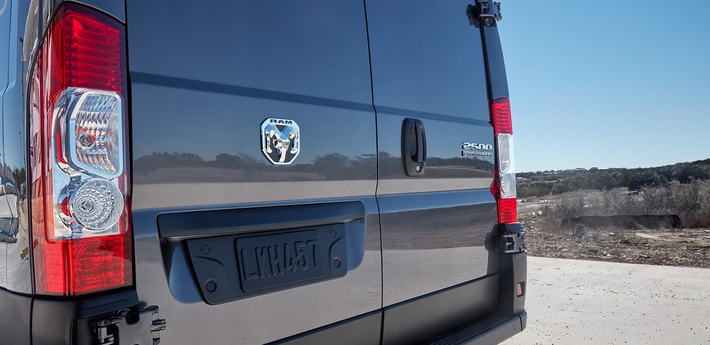 Display The rear doors on a black 2024 Ram ProMaster 2500 Cargo Van.