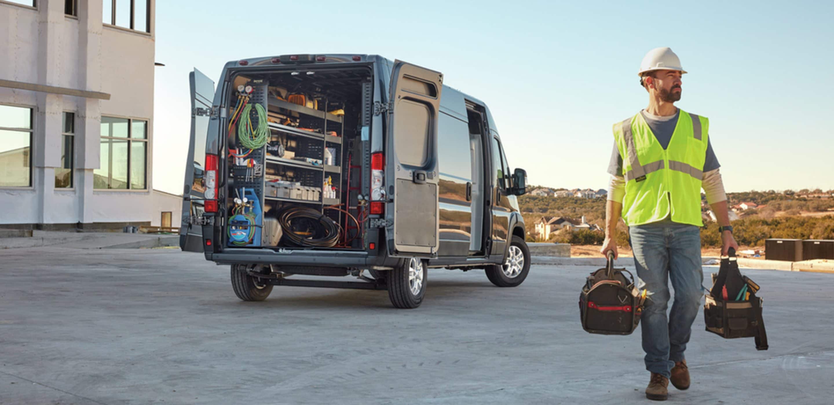 man in 2024 ram promaster gathering tools. 