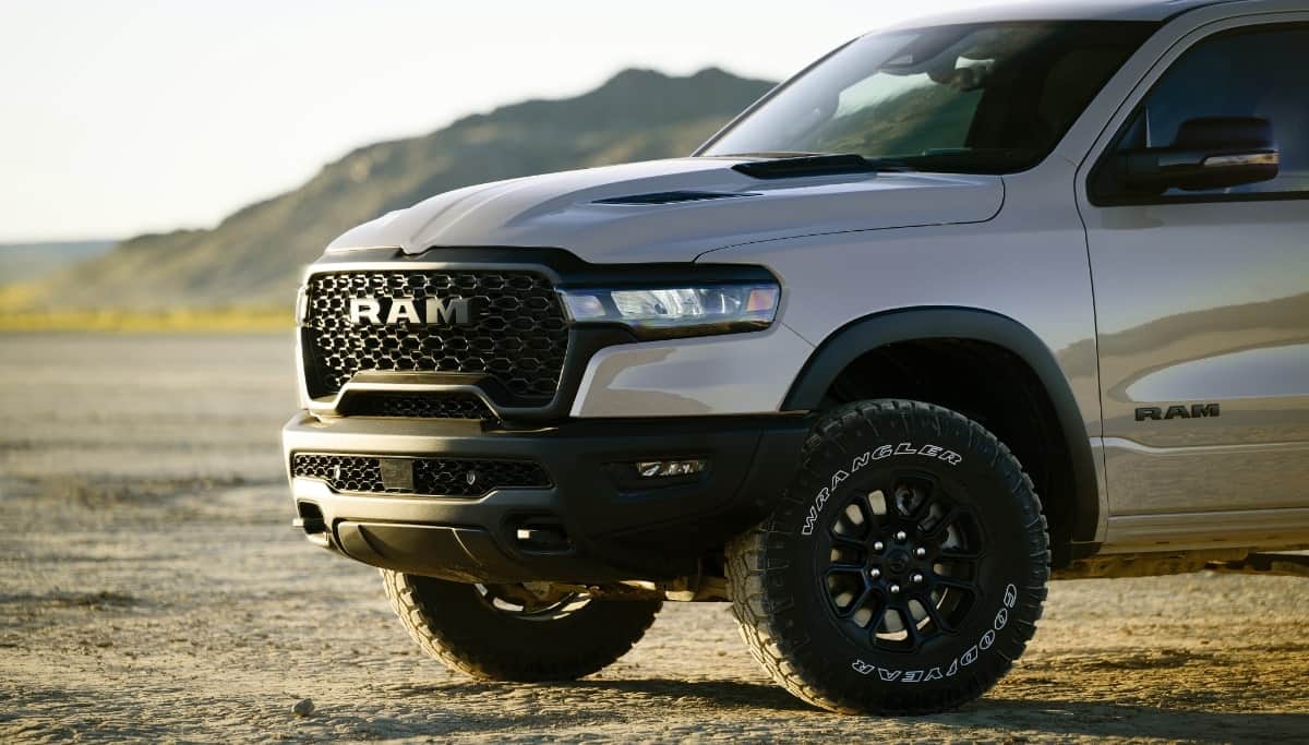 Display The driver-side front end of a silver 2025 Ram 1500 Rebel X.