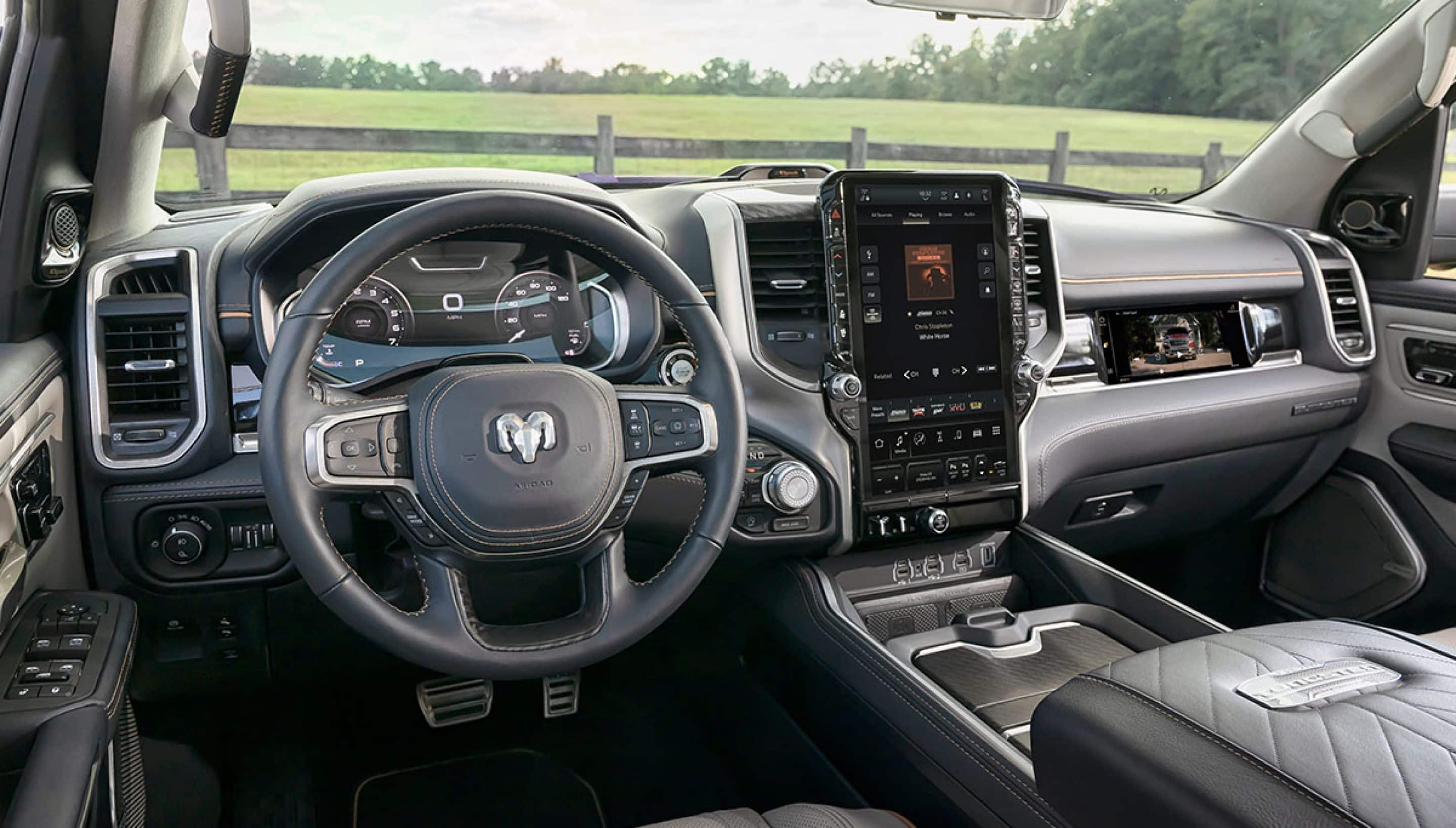 RAM 1500 black leather interior with aluminum painted accent trim and vertical mounted navigation screen