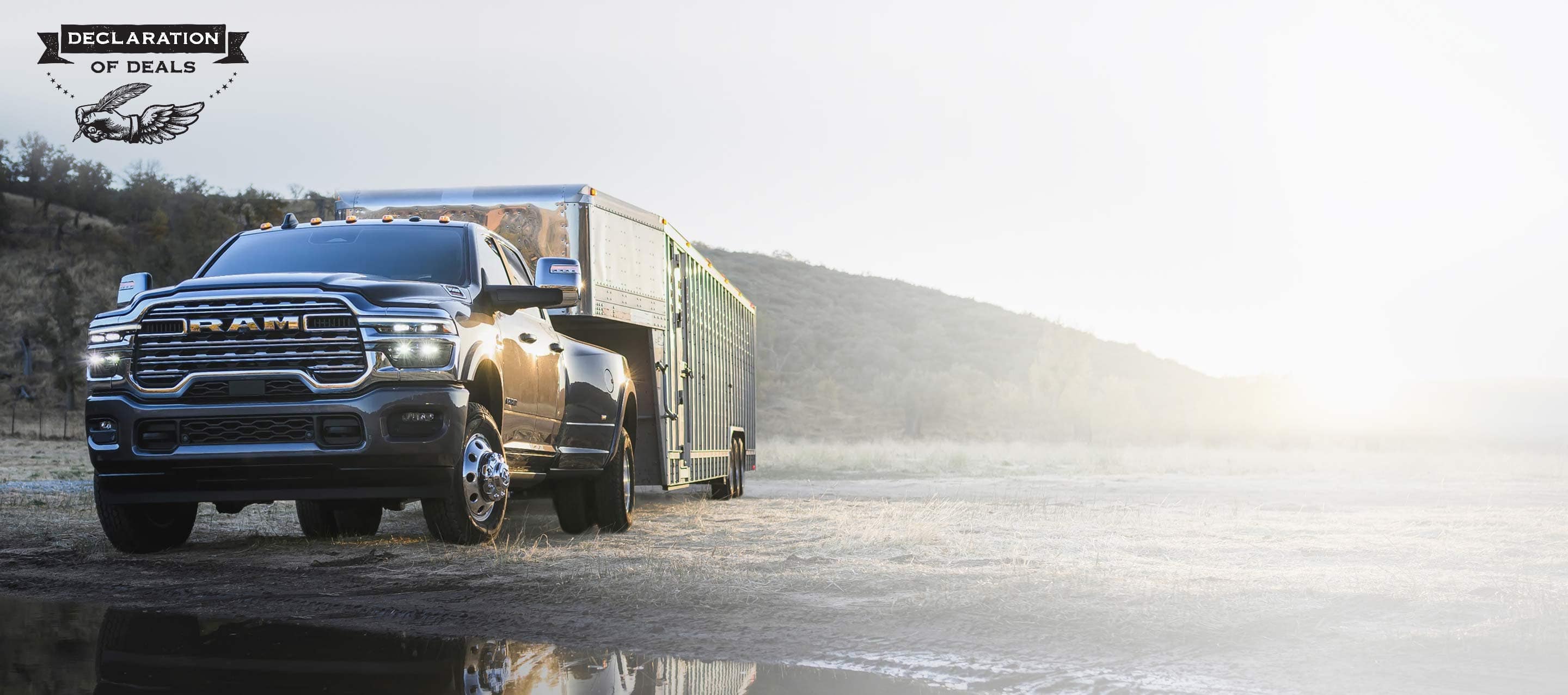 A red 2025 Ram 3500 Laramie 4x4 Crew Cab towing an enclosed box. Declaration of Deals Sales Event.