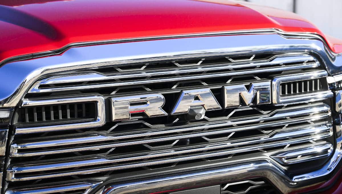 Display The grille on a red 2025 Ram 5500 Laramie Chassis Crew Cab.