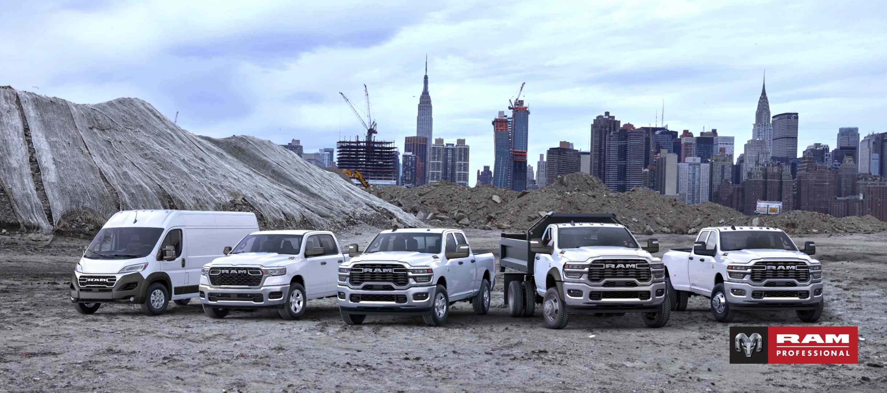 The 2025 Ram Brand lineup all in white, parked side-by-side at a pre-construction site, with a cityscape in the background. From left to right: a Ram ProMaster 3500 SLT High Roof Cargo Van, a Ram 1500 Tradesman 4x4 Crew Cab, a Ram 2500 Tradesman 4x4 Crew Cab, a Ram 5500 Tradesman Chassis Regular Cab with dump body upfit and a Ram 3500 Tradesman 4x4 Crew Cab. Ram professional.