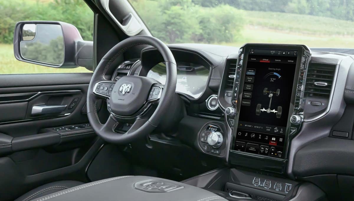 Display The steering wheel and very large Uconnect touchscreen in the 2026 Ram 1500 Rebel.