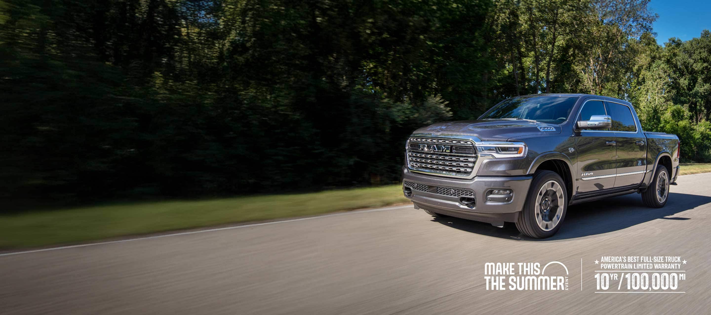 A gray 2026 Ram 1500 Limited 4x4 Crew Cab traveling down a country road. Make this the summer Event.