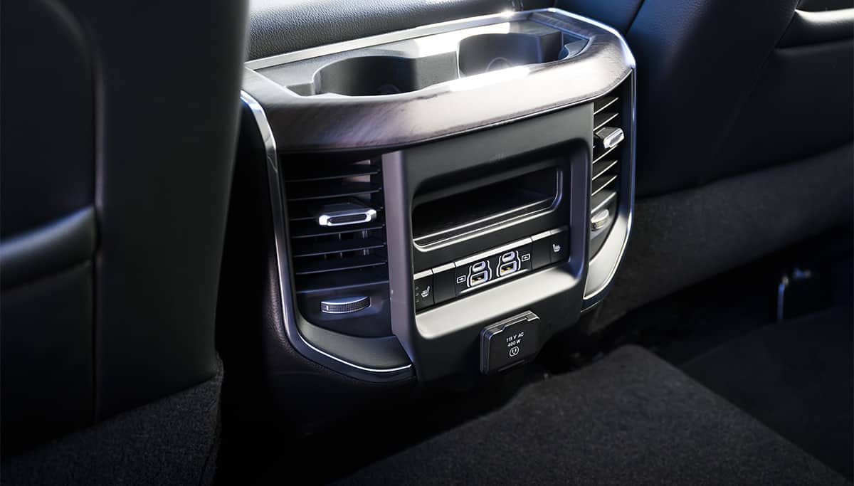 Display The center console rear cubby bin in the 2026 Ram 2500.
