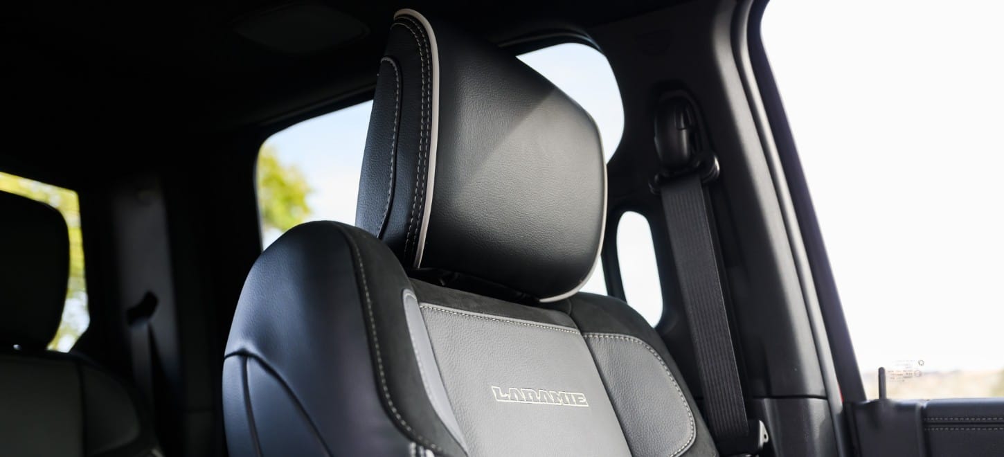The driver seat headrest inside the 2026 Ram 2500 Laramie 4x4 Crew Cab heavy duty pickup truck