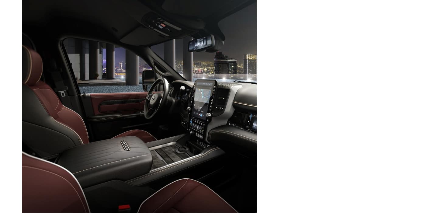 Black and Ebony Red leather-trimmed front seats in a 2026 Ram 3500 Limited Crew Cab heavy duty truck.