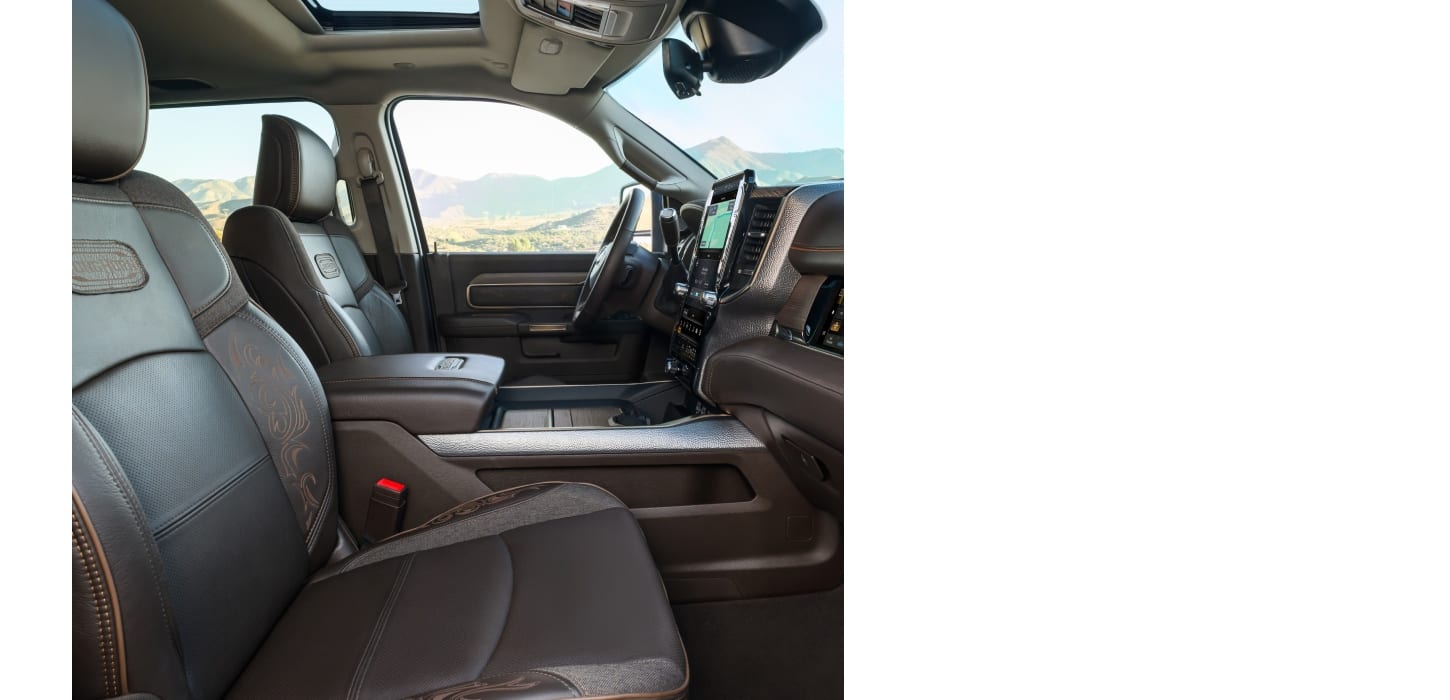 Bison Brown leather-trimmed front seats and an open sunroof in the 2026 Ram 2500 Limited Longhorn Crew Cab heavy duty truck.