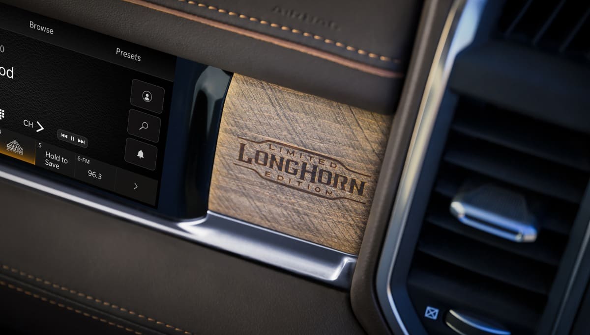 Display The Front Passenger Interactive Display and Limited Longhorn Edition badge on the dash in the 2026 Ram 3500.