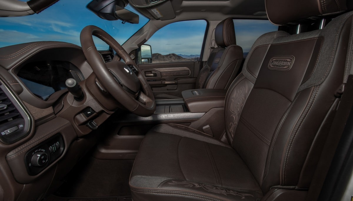 Display The front seats in the 2026 Ram 3500 Limited Longhorn with an embroidered Limited Longhorn Edition logo on them.