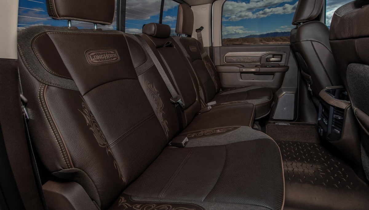 Display The rear seats in the 2026 Ram 3500 Limited Longhorn with an embroidered Limited Longhorn Edition logo on them.
